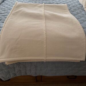 cozy cream throw. A touch  of warmth.couple tiny spots notes in pic